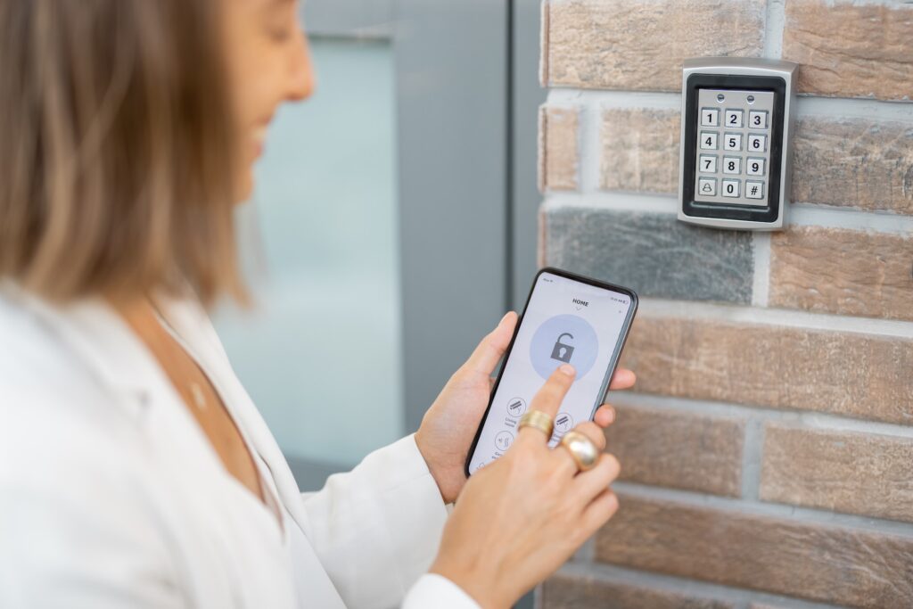Opening door with a smart phone and keyboard on the wall